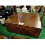 A burr walnut writing slope with fitted interior and inkwell.