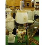 A Victorian pottery oil lamp
with brass mounts and glass shade and chimney, 23".