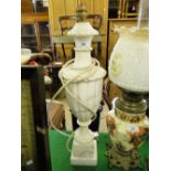 A carved alabaster table lamp.