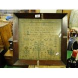 A framed sampler dated 1848.