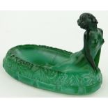 A green glass figure of a nude bathing girl,
possibly Hoffman, length 4.25".