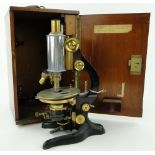 A Leitz microscope,
height 13.25" in fitted case containing spare lenses, etc.