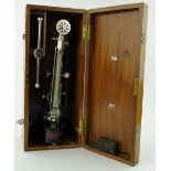 A Shores scleroscope (metal hardness tester) with fittings,
in case, height 19".