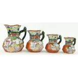 A graduated set of 4 Victorian Mason's octagonal jugs
with panels depicting chinoiserie figures,