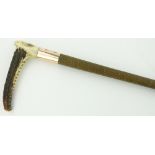 A gold mounted riding crop 
with stag horn handle, 32.75".