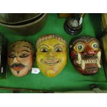 A carved and painted wood mask
with yellow face, height 8.5" and 2 other painted tribal masks, (3).