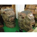 A pair of Oriental carved and painted wood temple lions.