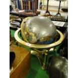 A terrestrial globe in gimballed brass stand.