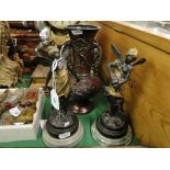 Pair of bronze fairy figures on marble plinths.