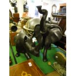 Large carved ebony rhino and elephant figures.