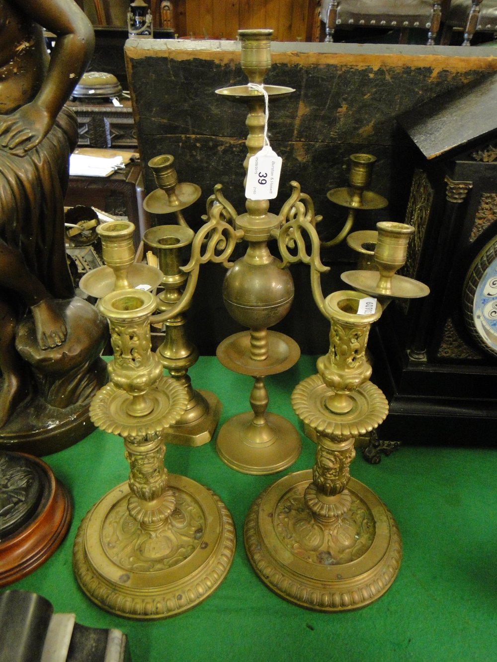 Brass candelabrum and 2 pairs of candlesticks.