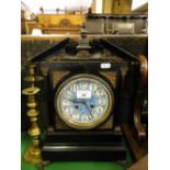 A Victorian mantel clock with porcelain dial.