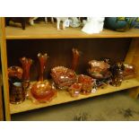 Carnival glass and copper lustre jugs.