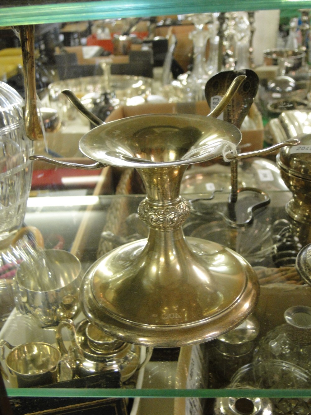 A Silver flambe stand, 8.