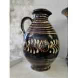 19th century slip glaze earthenware jug.