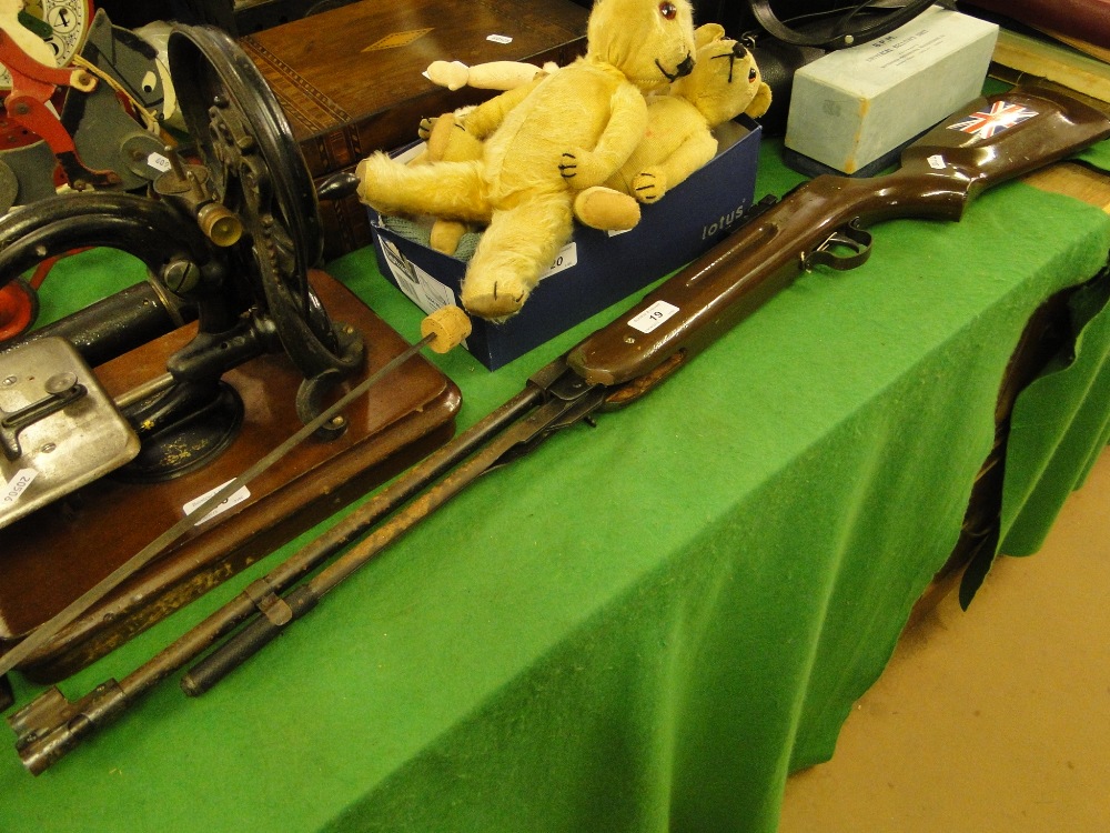 An under lever action air rifle.