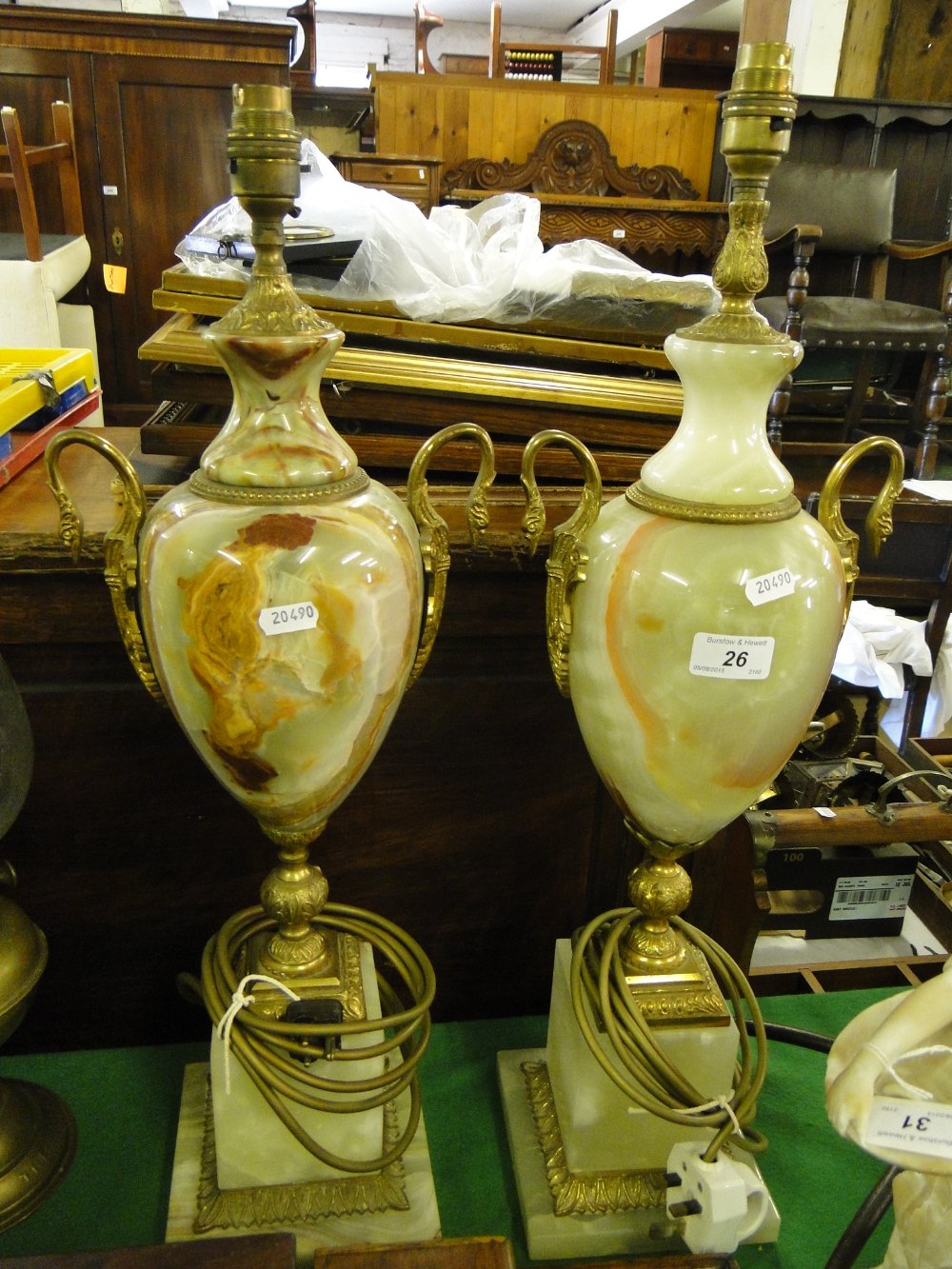 2 onyx table lamps with brass mounts.