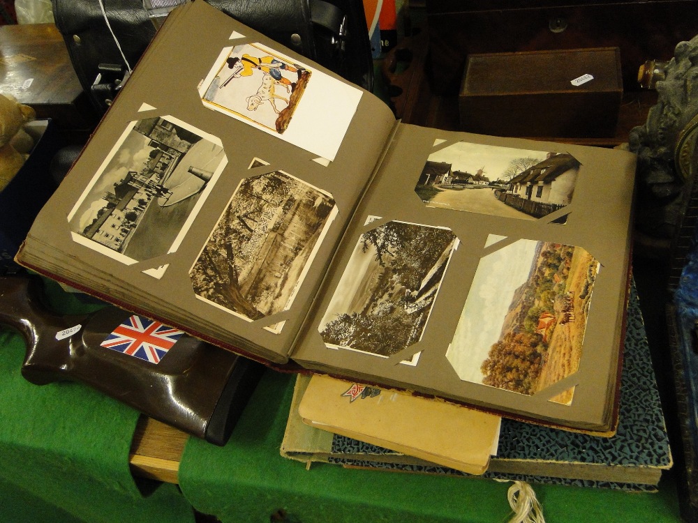 3 postcard albums and a photograph album.