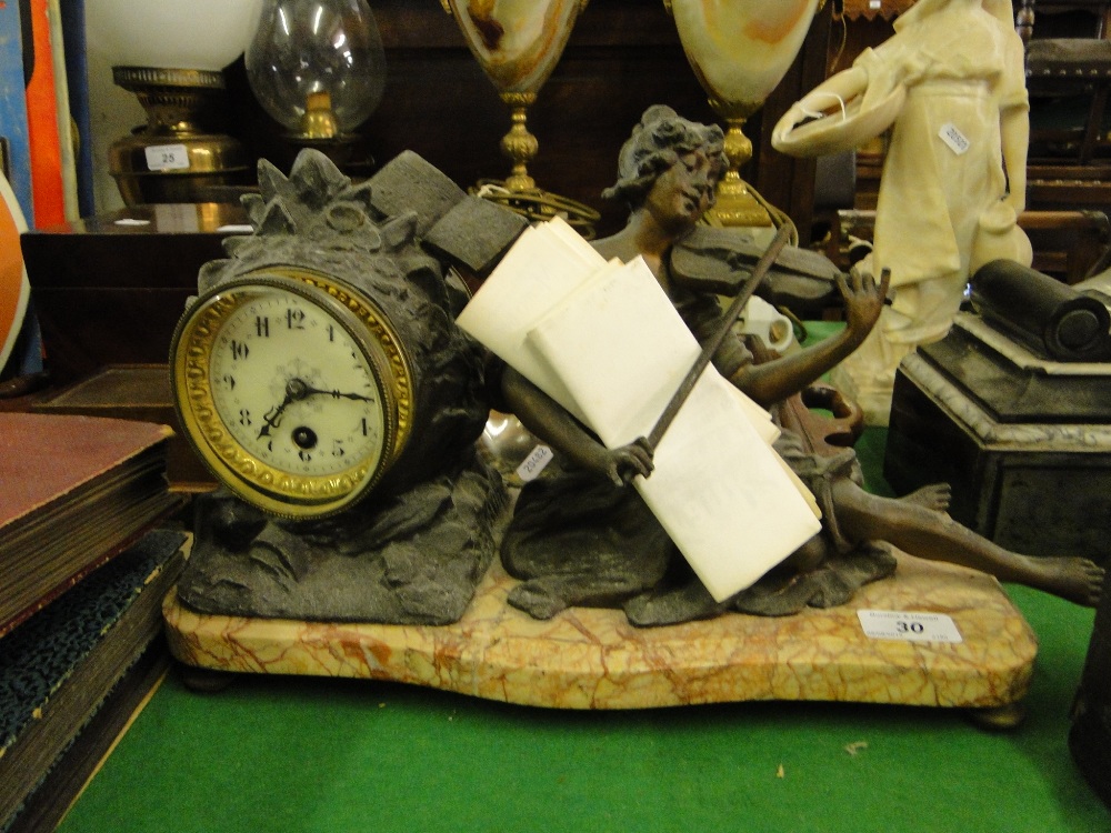 A spelter clock on marble base.