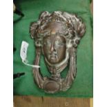 An Art Nouveau brass door knocker, height 7".