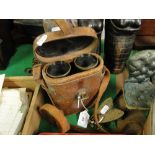 French binoculars in leather case and a fly vesta.