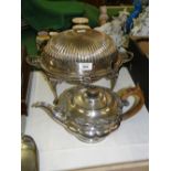 A silver plated rollover bacon dish and a silver plated teapot.