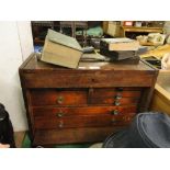 An oak engineer's cabinet with tools, books, etc.