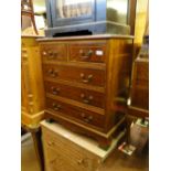 A crossbanded mahogany 5 drawer chest of small size.