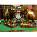 A pair of carved wood elephants.