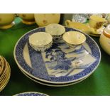 7 Chinese porcelain tea bowls and 2 blue and white chargers.