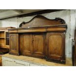 A Victorian mahogany 4 door inverted break front sideboard.