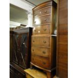 A reproduction mahogany bow front chest on chest with 6 drawers.