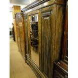 Edwardian walnut single mirror door wardrobe with drawer to the base.