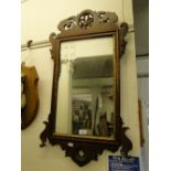 Antique mirror in carved mahogany frame