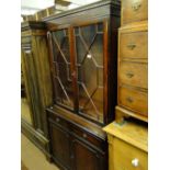 A reproduction mahogany 2-section bookcase.