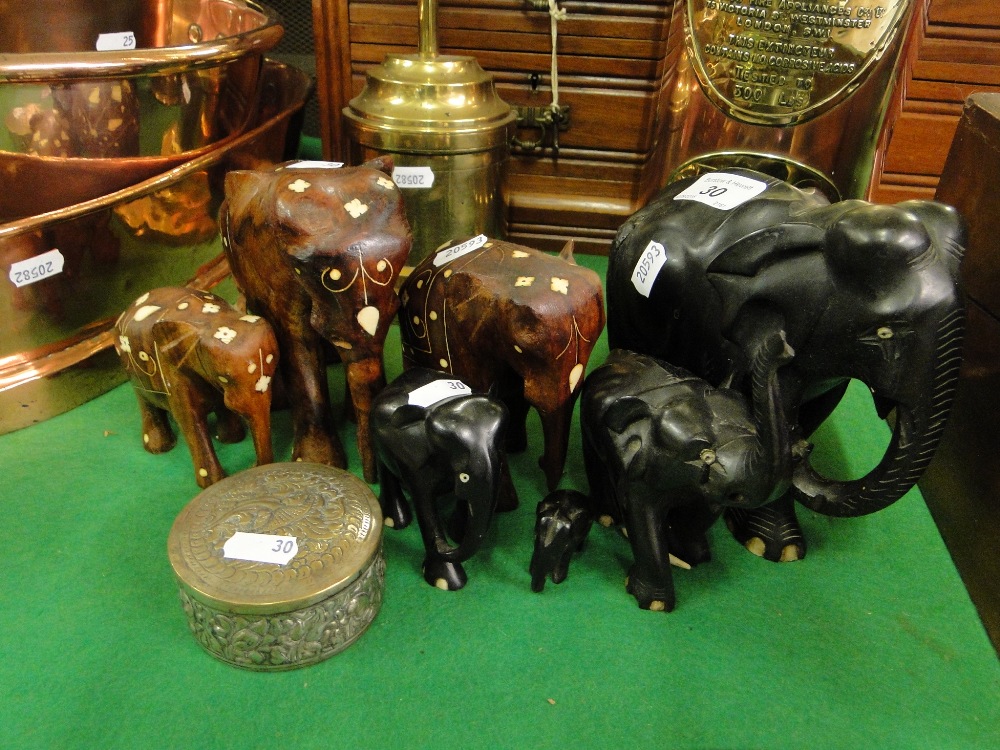 Carved wood elephants and a box.