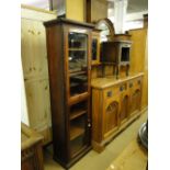 A narrow Victorian mahogany shop display cabinet with 2 glazed doors.