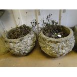 Pair of weathered stoneware embossed planters.