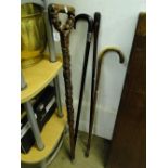 Carved wood walking stick & 3 others (4)