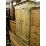 A pine 2-door wardrobe.