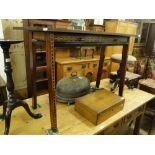 A stylised mahogany side table with 2 frieze drawers and inlaid decoration.