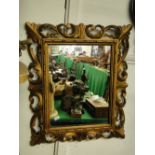 A Carved giltwood framed wall mirror