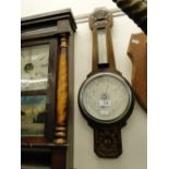 Aneroid barometer in carved oak case