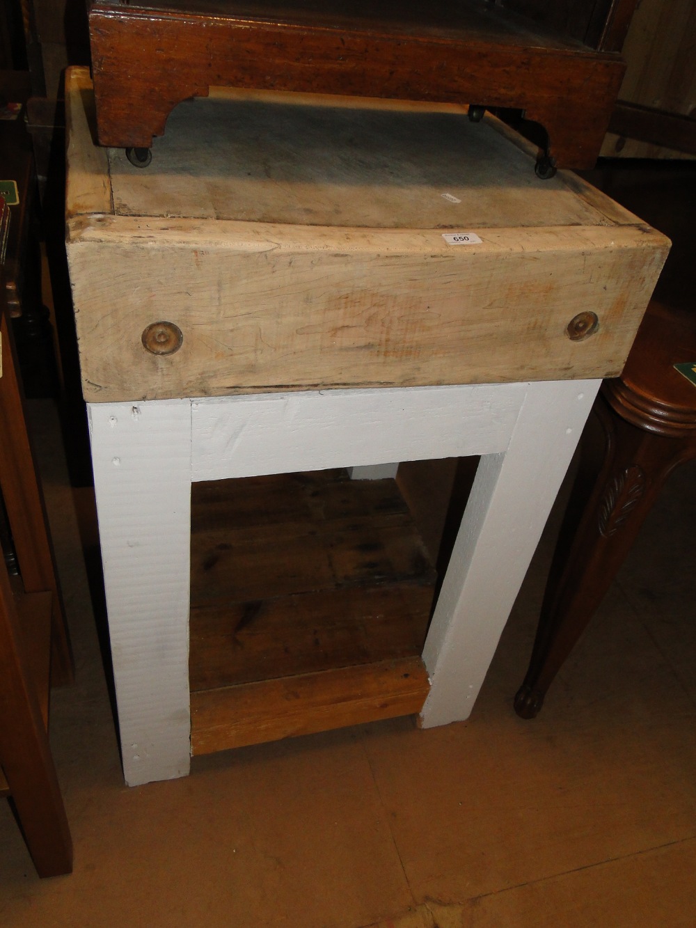 A Victorian pine square butcher's block on stand.
