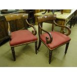 A pair of 19th century mahogany elbow chairs, upholstered seats and turned legs.