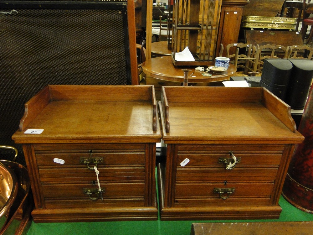 A pair of small 2 drawer table top chest.