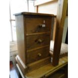 A small pine 3-drawer chest.