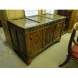 An 18th century joined oak coffer, with lozenge carved panelled front on bracket feet.