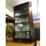 Victorian mahogany hanging corner cabinet with glazed door.