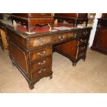 A reproduction mahogany twin pedestal writing desk.